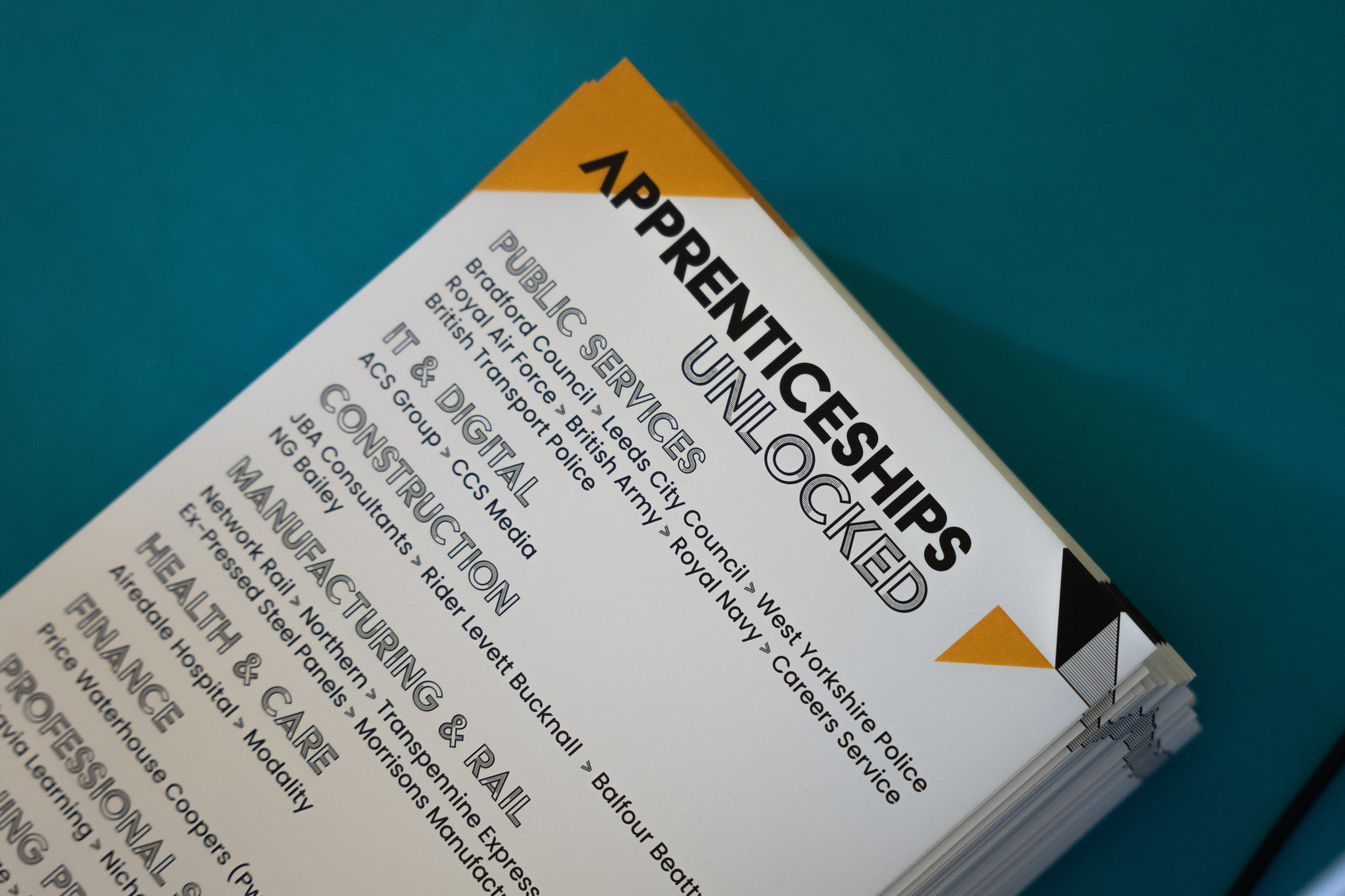 Picture of an Apprenticeships Unlocked leaflet, listing organisations present
